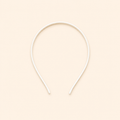 White headband on a beige background