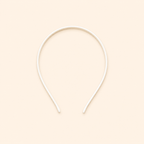 White headband on a beige background